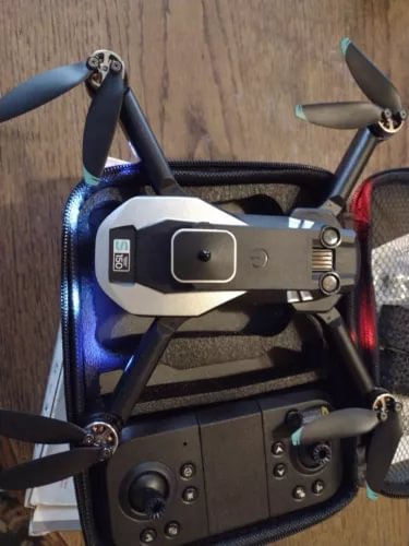 Foldable quadcopter drone with dual camera and four folded propellers