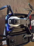 Foldable quadcopter drone with dual camera and four folded propellers