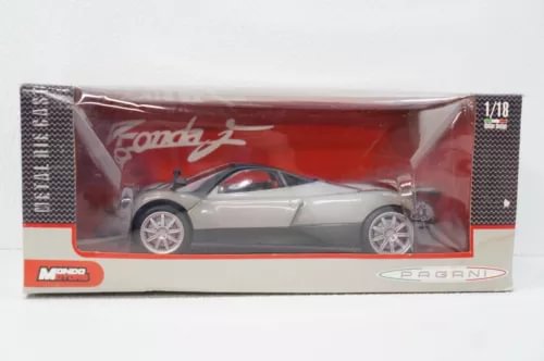 Silver 1:18 diecast sports car model in retail box