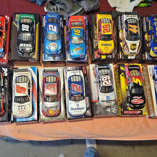 1/24 scale diecast model cars in retail boxes, assorted designs