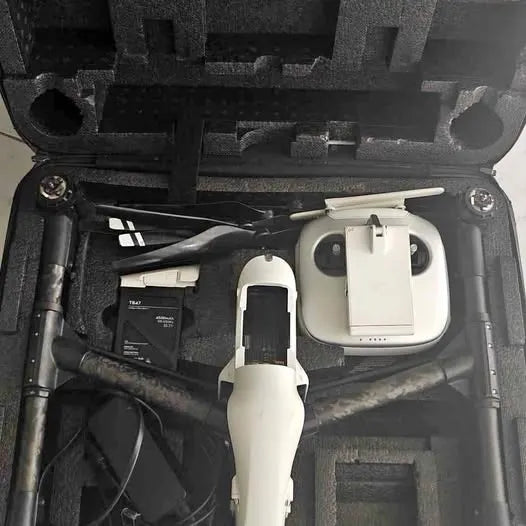 White DJI Inspire 1 drone with remote and battery in hard case