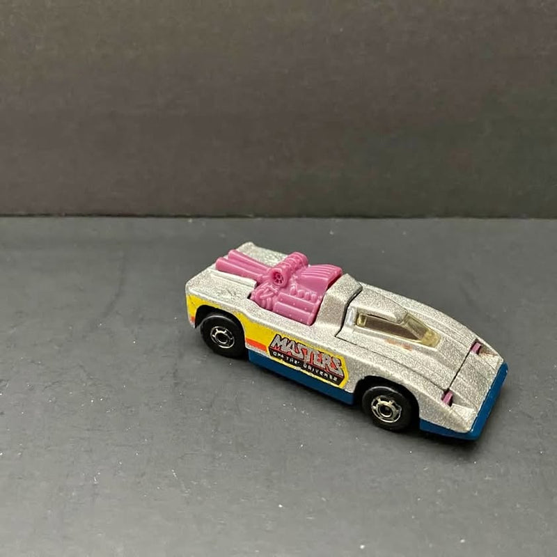Diecast collectible car, silver body with blue and yellow decals and pink top rack.
