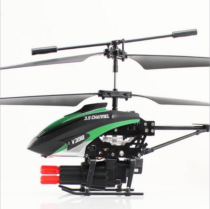 Small RC helicopter drone with green-and-black fuselage, main rotor and tail boom