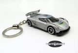 Grey diecast car keychain with silver ring and detailed miniature vehicle