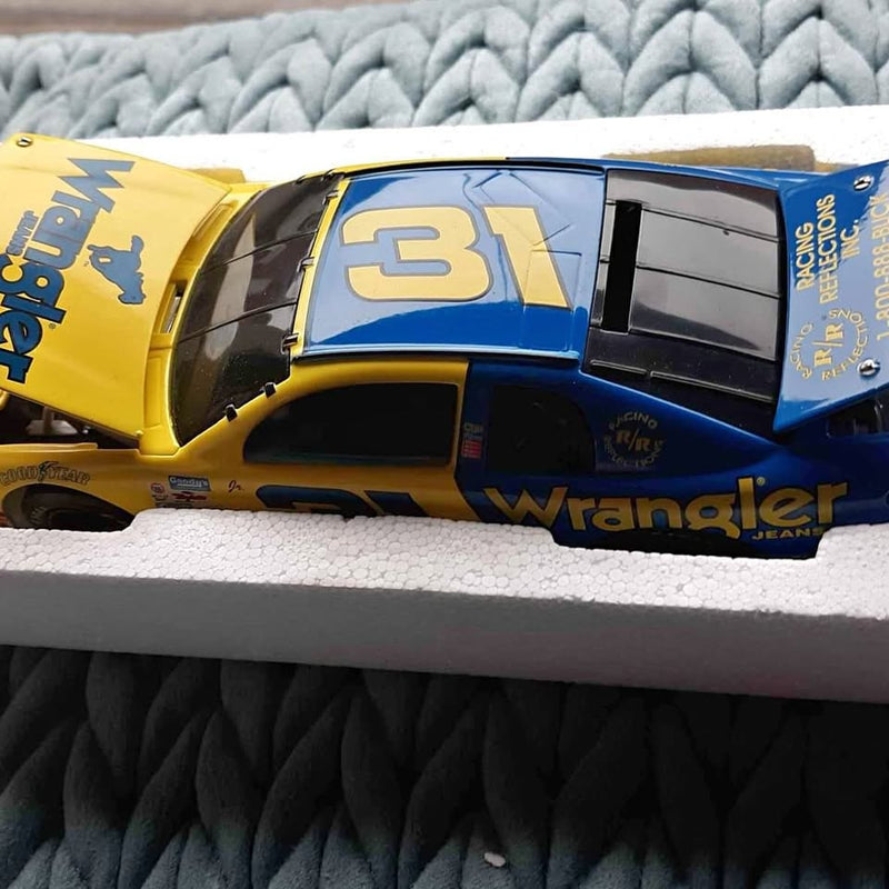 Blue and yellow #31 Wrangler diecast race car with decals and black windows