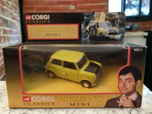 Corgi Mr Bean mini diecast toy car, yellow in display box with Mr Bean face