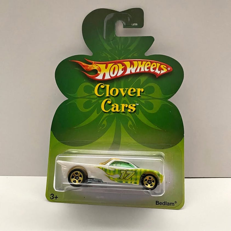 Hot Wheels diecast car in clover-themed blister packaging, green and white