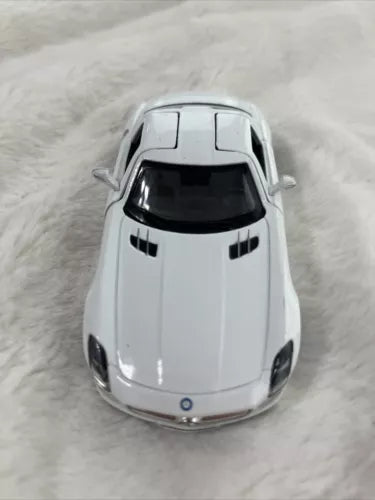White diecast toy car model with front hood and grille detail