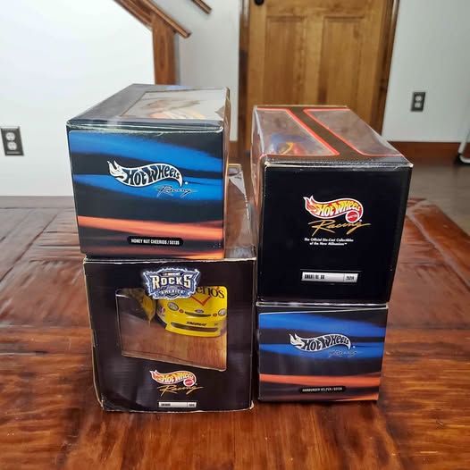 Hot Wheels diecast car lot of 4 in branded retail boxes, assorted designs