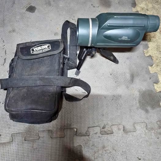 Handheld monocular device with dark carrying pouch and strap