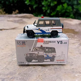 1/64 die-cast police car model in box, white and blue with red light