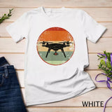 Unisex white T-shirt with large circular drone graphic and pilot silhouette