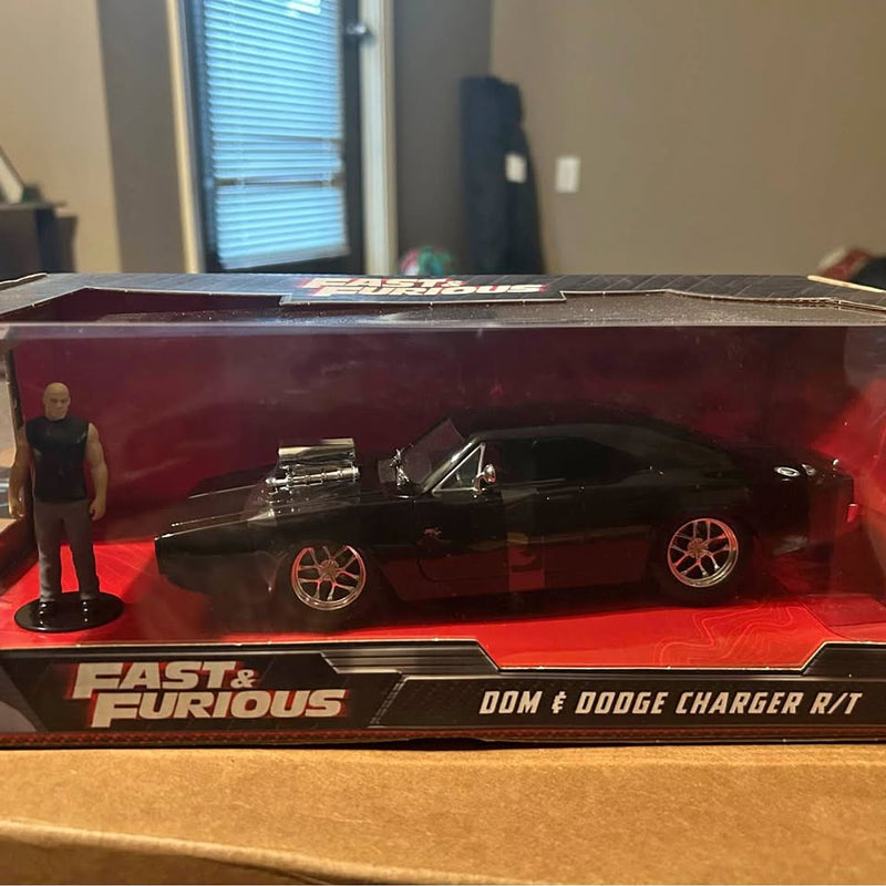 Diecast Dodge Charger R/T model in display box with small standing figure