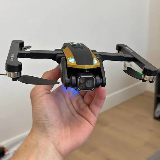 GPS camera drone with front camera and foldable propellers, held in hand
