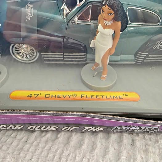 Diecast 47' Chevy Fleetline model car with front grille and yellow model badge