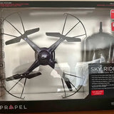 Quadcopter drone with camera, four-blade design, on retail box