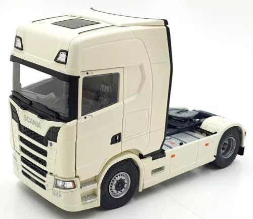 Ivory white diecast Scania truck cab, front-left 3/4 view