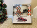 Stunt drone toy retail box with orange-and-black RC controller and rotor