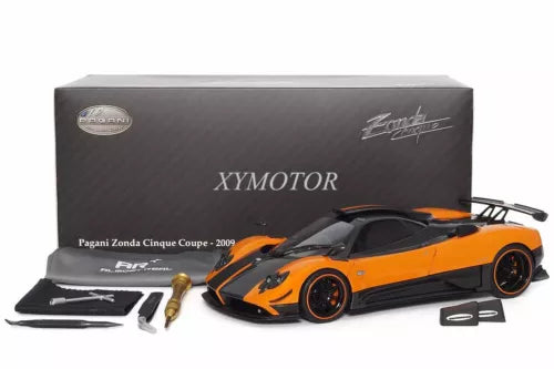 Orange Pagani Zonda Cinque coupe 2009 diecast car with accessory parts and tools