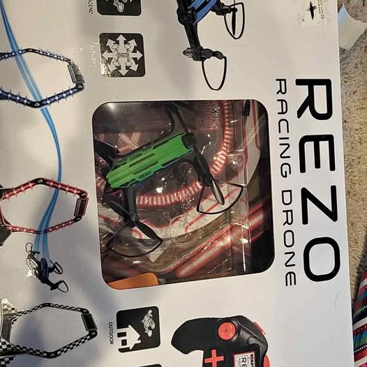 Rezo racing drone retail box showing quadcopter and green prop