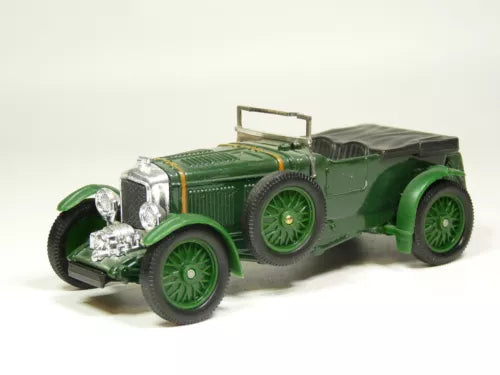 Green vintage diecast model car with open top, chrome grille and headlights