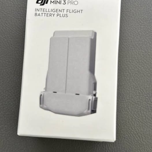 DJI Mini 3 Intelligent Flight Battery Plus, light gray battery pack with connector