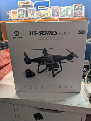 Black GPS FPV RC drone with camera (HS100) shown on retail product box