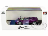 Purple metal diecast roadster model car with 1:64 scale front view