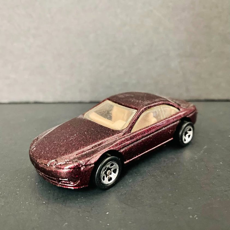 Collectible Hot Wheels diecast sport car, dark brown maroon Lexus SC400