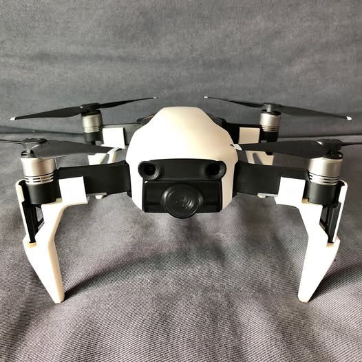 DJI Mavic Air drone with front camera and four propellers, silver and dark gray