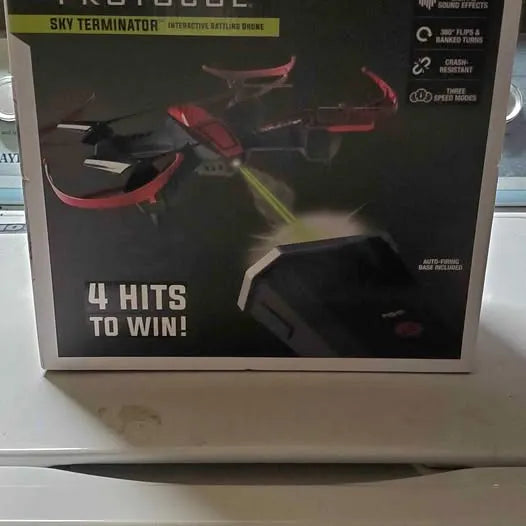 Drone toy box with red and black drone artwork and '4 HITS TO WIN'.