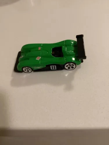 Green diecast race car with black rear wing, wheels, and #11 on side