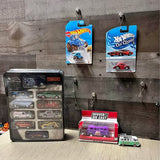 Hot Wheels diecast car set with boxed cars and loose mini cars, red and blue