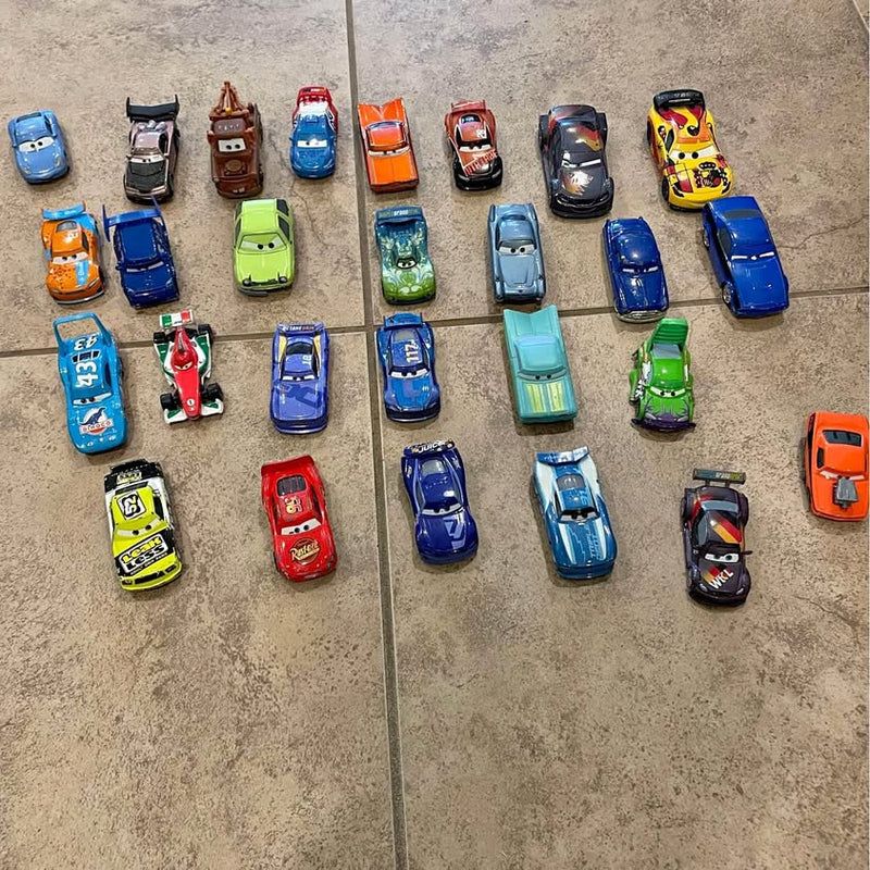 Diecast metal car set with 27 assorted vehicles in various colors, arranged on tile