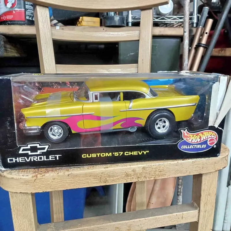 Yellow diecast 1957 Chevy-style car in Hot Wheels Collectibles box