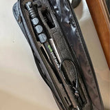 Black zippered drone carrying case interior with tool compartments and accessories