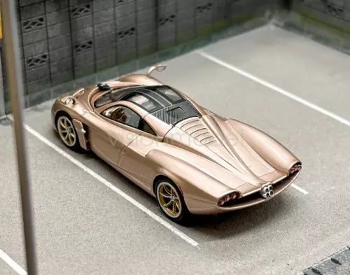 Gold racing sports diecast metal car, front 3/4 view