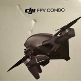 DJI FPV drone with dark body and four propellers, compact quadcopter