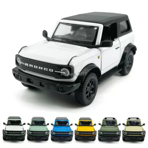 White 2-door Ford Bronco diecast SUV toy car, black roof and grille, off-road tires.