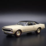 Cream diecast model car, front 3/4 view with chrome grille