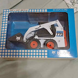 Die-cast Bobcat 773 skid-steer in retail box, scale 1:25, orange wheels