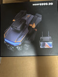 Quadcopter drone with remote controller, dark gray with blue status lights