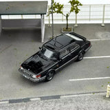 Saab 900 Turbo black 1/64 scale diecast car model, front three-quarter view