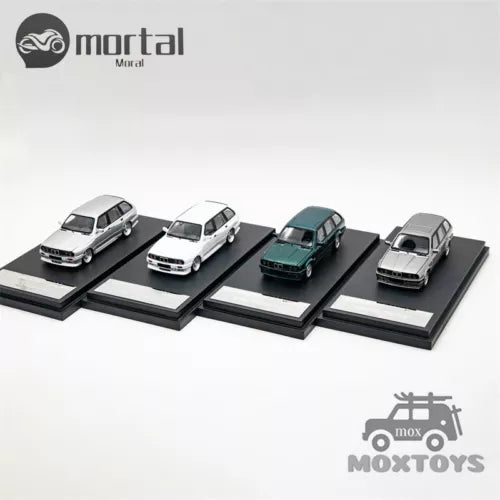 1:64 E30 Touring diecast model cars set, four cars on display stands.