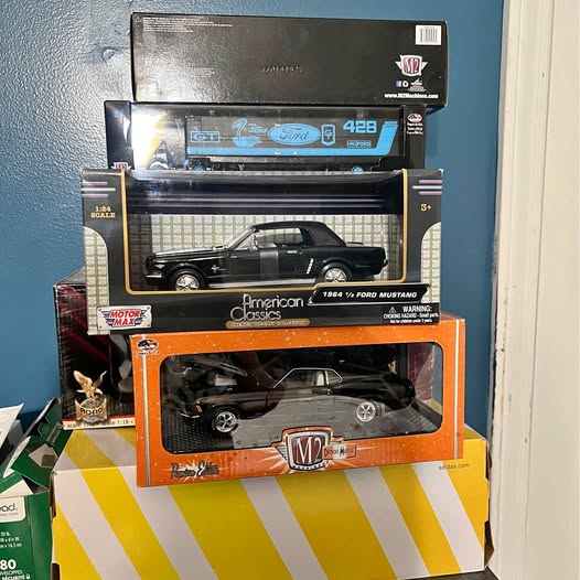 Diecast Ford Mustang model car in retail box, black with silver wheels