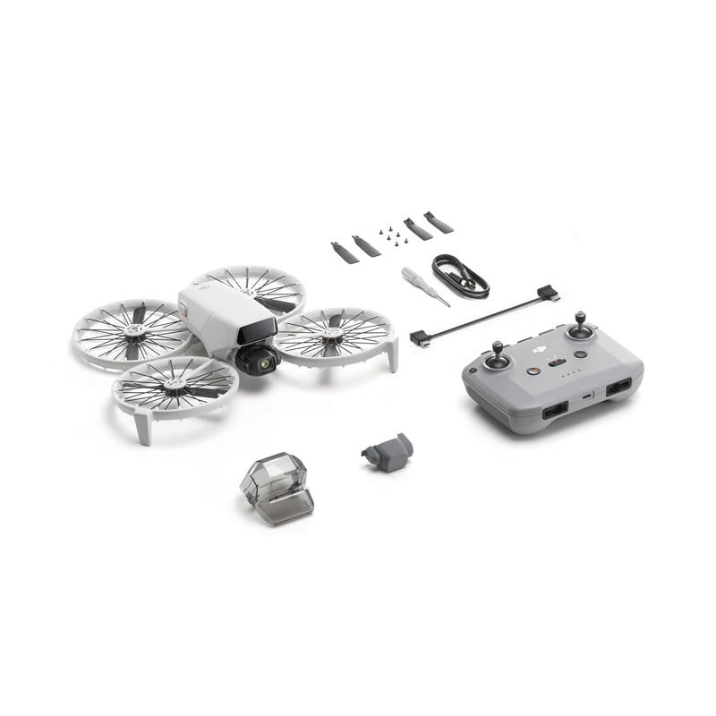 Camera drone with foldable quadcopter arms, spare propellers, and remote controller