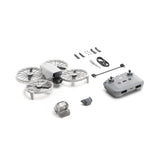 Camera drone with foldable quadcopter arms, spare propellers, and remote controller