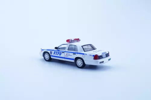 1:64 NYPD police diecast car with blue stripes and lightbar, white body