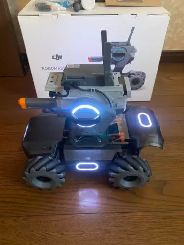 DJI RoboMaster S1 education robot with glowing blue LED lights and wheeled base