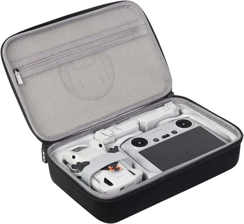 Hard shell travel case with mesh lid, holding drone controller and accessories